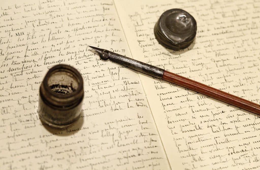 The pen and inkwell used by St. Therese of Lisieux rests on a facsimile of handwritten pages from the saint's "Story of a Soul." St. Therese is patron of missionaries and missions. (CNS photo/Nancy Phelan Wiechec)