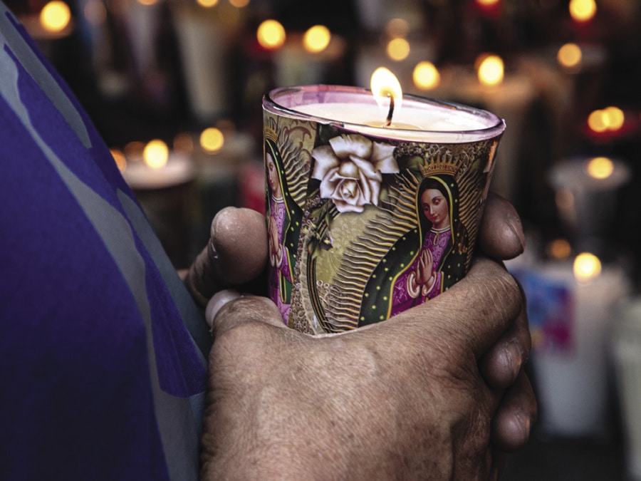 In the days leading up to the feast day in 2020, thousands of faithful had already come to honor Mary by lighting a candle such as this one and offering prayers.
