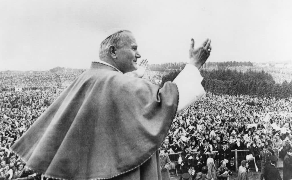 Pope John Paul II blesses the crowd in 1979 at the shrine of Our Lady of Knock in Ireland. Pope Francis will visit Dublin and Knock, Ireland, Aug. 25-26, mainly for the World Meeting of Families. But he also will meet Irish government leaders and is expected to meet with survivors of sexual abuse. (CNS file photo)