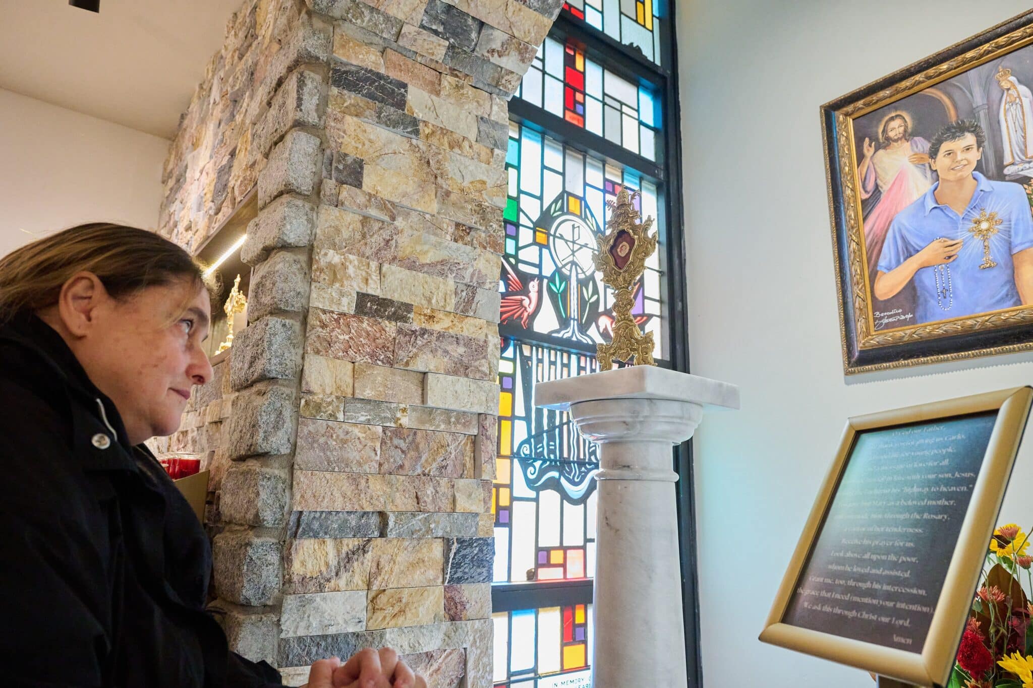 Antonia Salzano Acutis, mother of Blessed Carlo Acutis, prays in the shrine dedicated to her son at St. Dominic Church in Brick, N.J., Oct. 1, 2023, the day it was dedicated by Bishop David M. O'Connell of Trenton, N.J. Pope Francis formally recognized a miracle attributed to the intercession of Blessed Acutis, a 15-year-old Italian teenager whose birth in 1991 will make him the first "millennial" to become a saint. (OSV News photo/Mike Ehrmann, Diocese of Trenton)