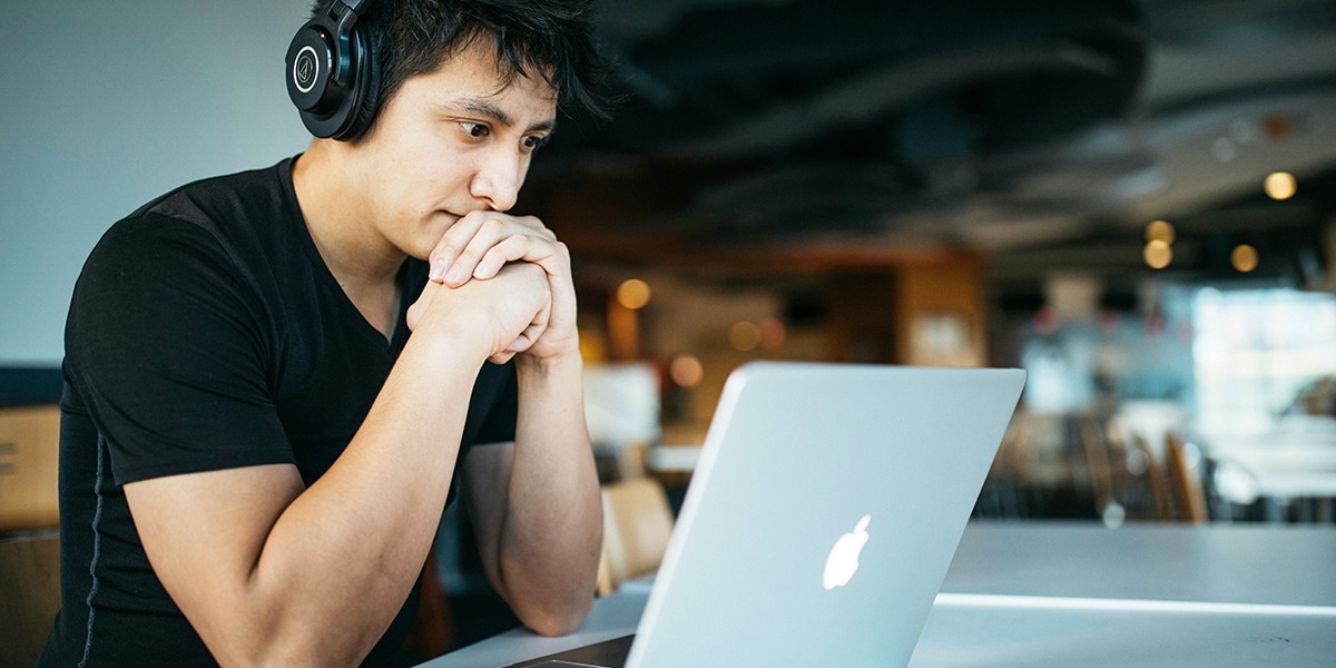 young man online on a computer