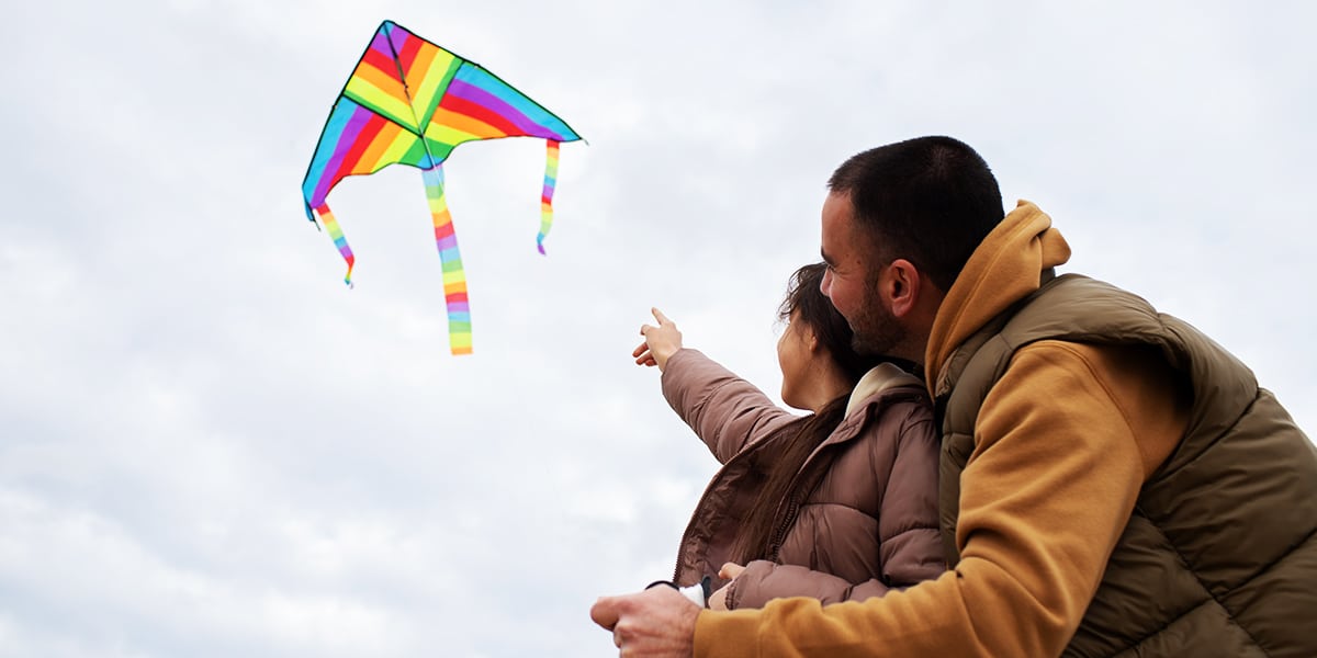 Father and son flying a kite