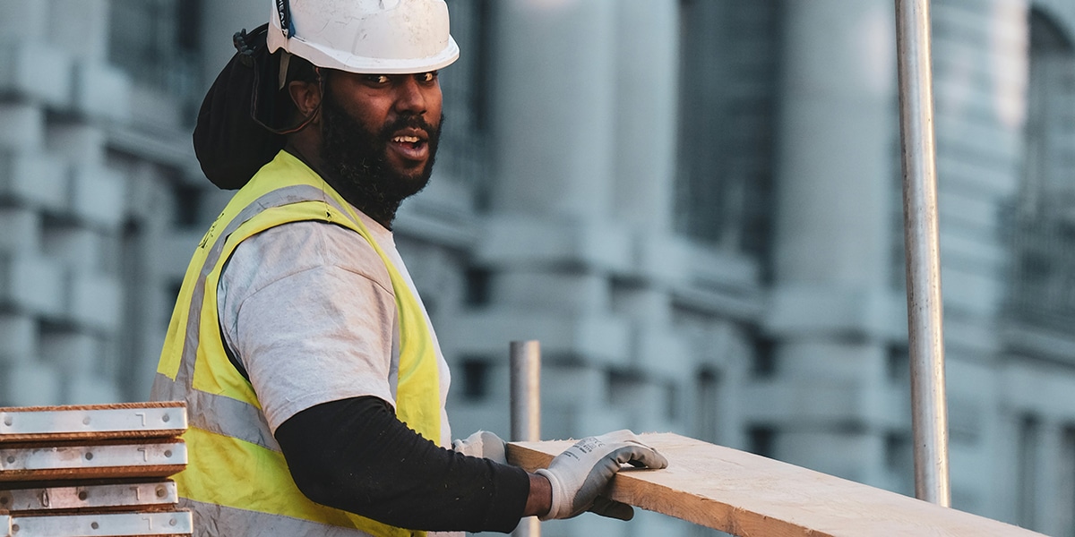 man wearing helmet working construction