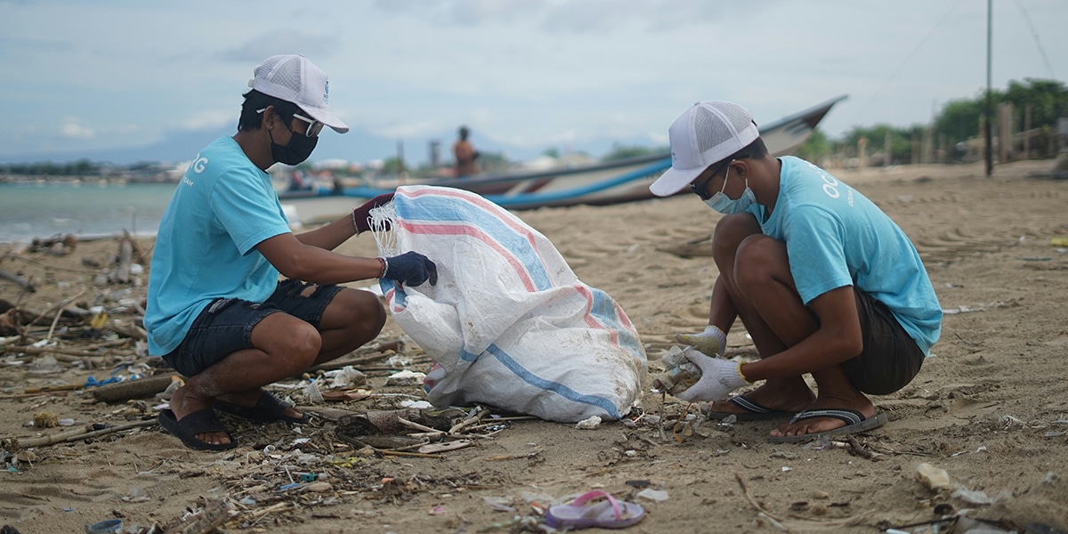 Volunteers cleaning a beach.