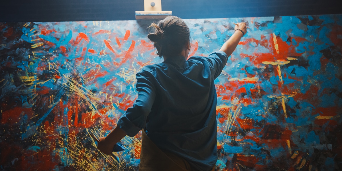 Artist female painting a canvas