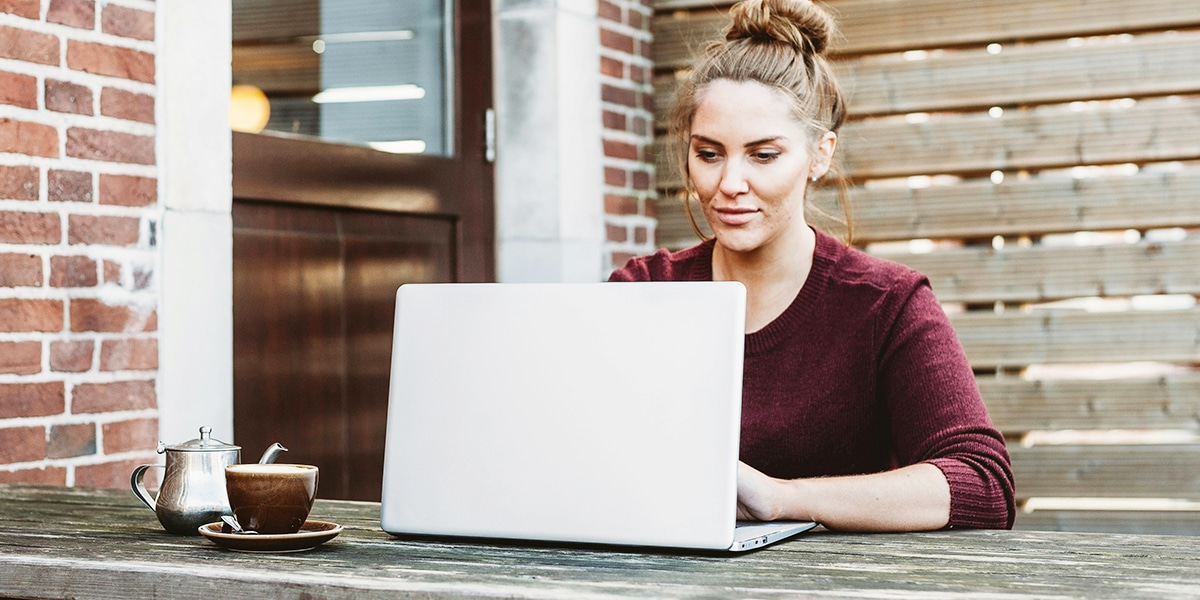 woman reading on her computer