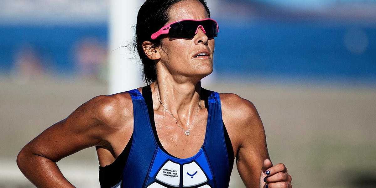 female athlete running a race.