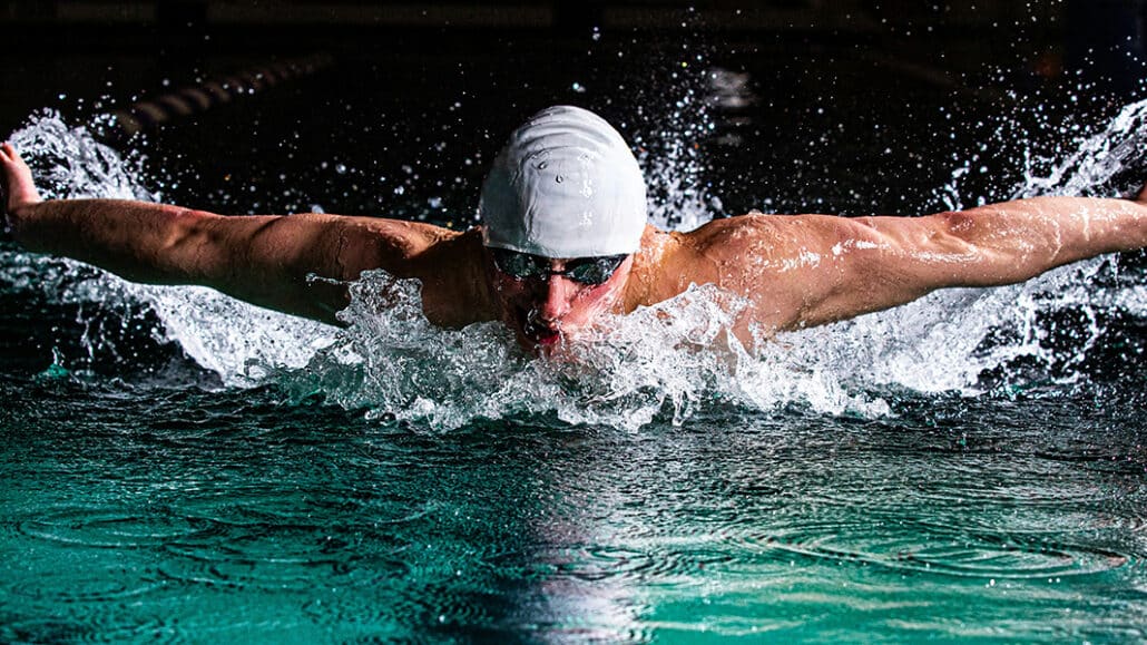 man swimming in a pool