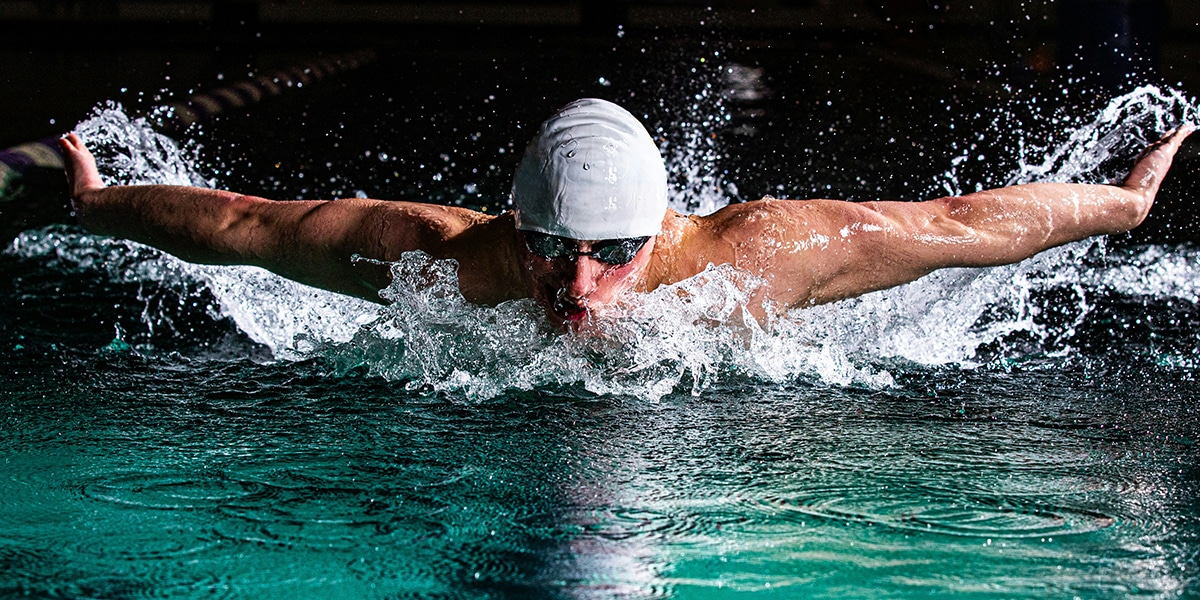 man swimming in a pool