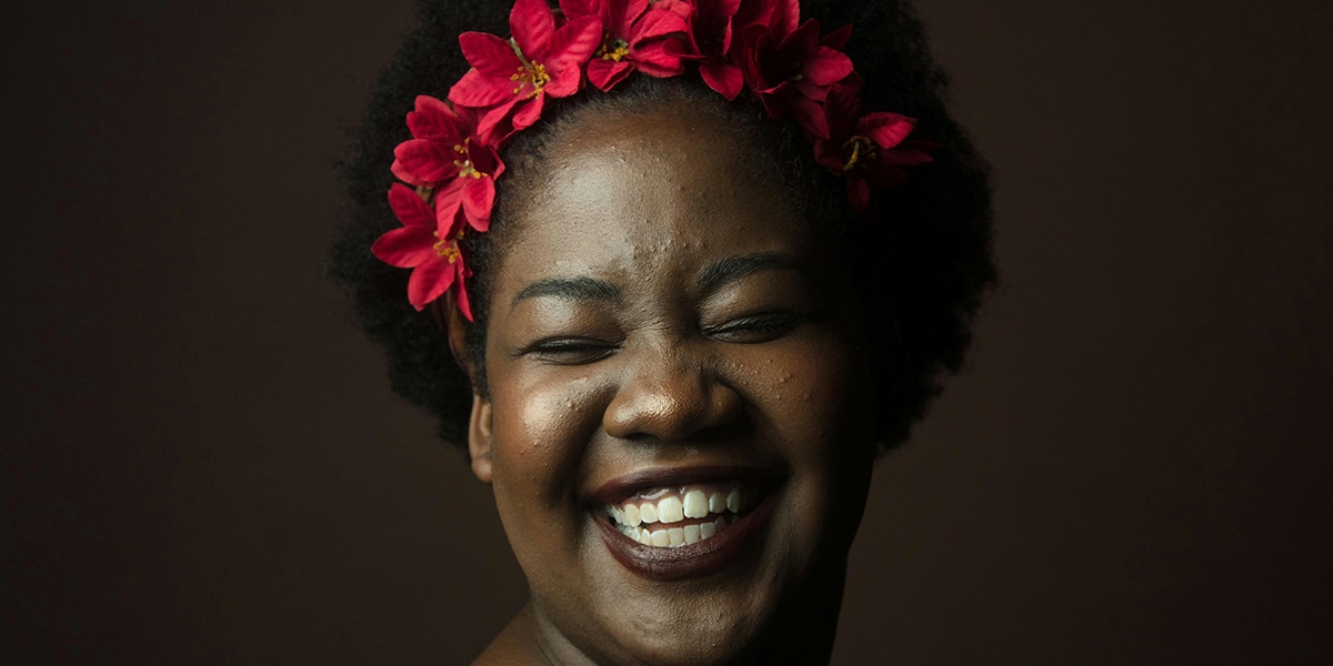 woman boldly wearing flowers in her hair