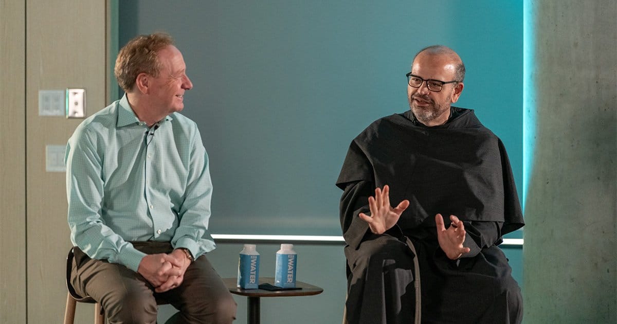 Franciscan Father Paolo Benanti, an adviser to Pope Francis on ethics and technology, talks with Microsoft President Brad Smith about ethics and artificial intelligence during an event on the Microsoft campus in Redmond, Wash., July 23, 2024. Father Benanti is a member of the United Nations’ advisory body on artificial intelligence.