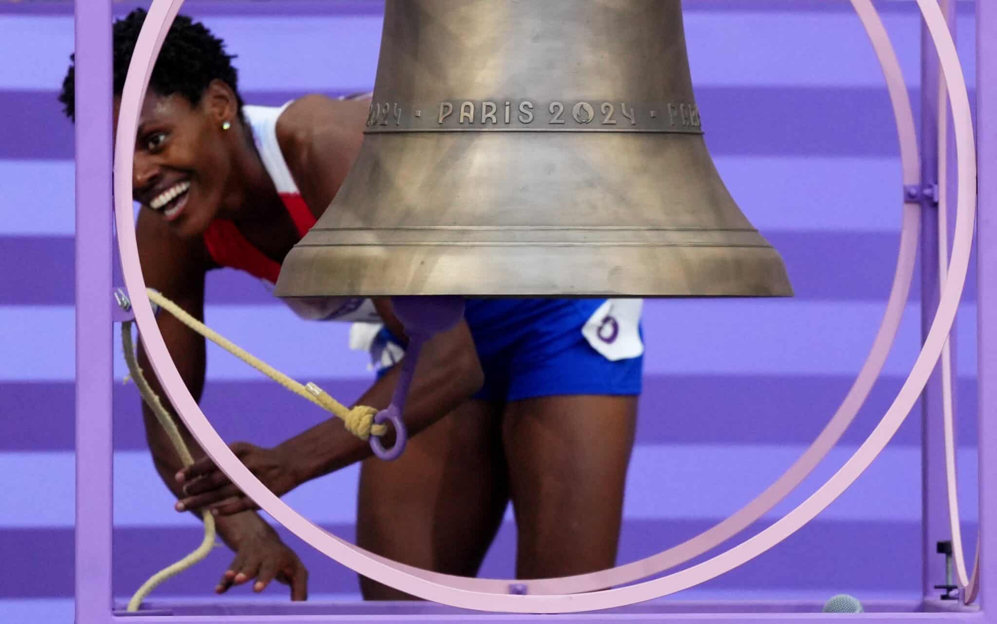 Marileidy Paulino of the Dominican Republic rings the Olympic bell.