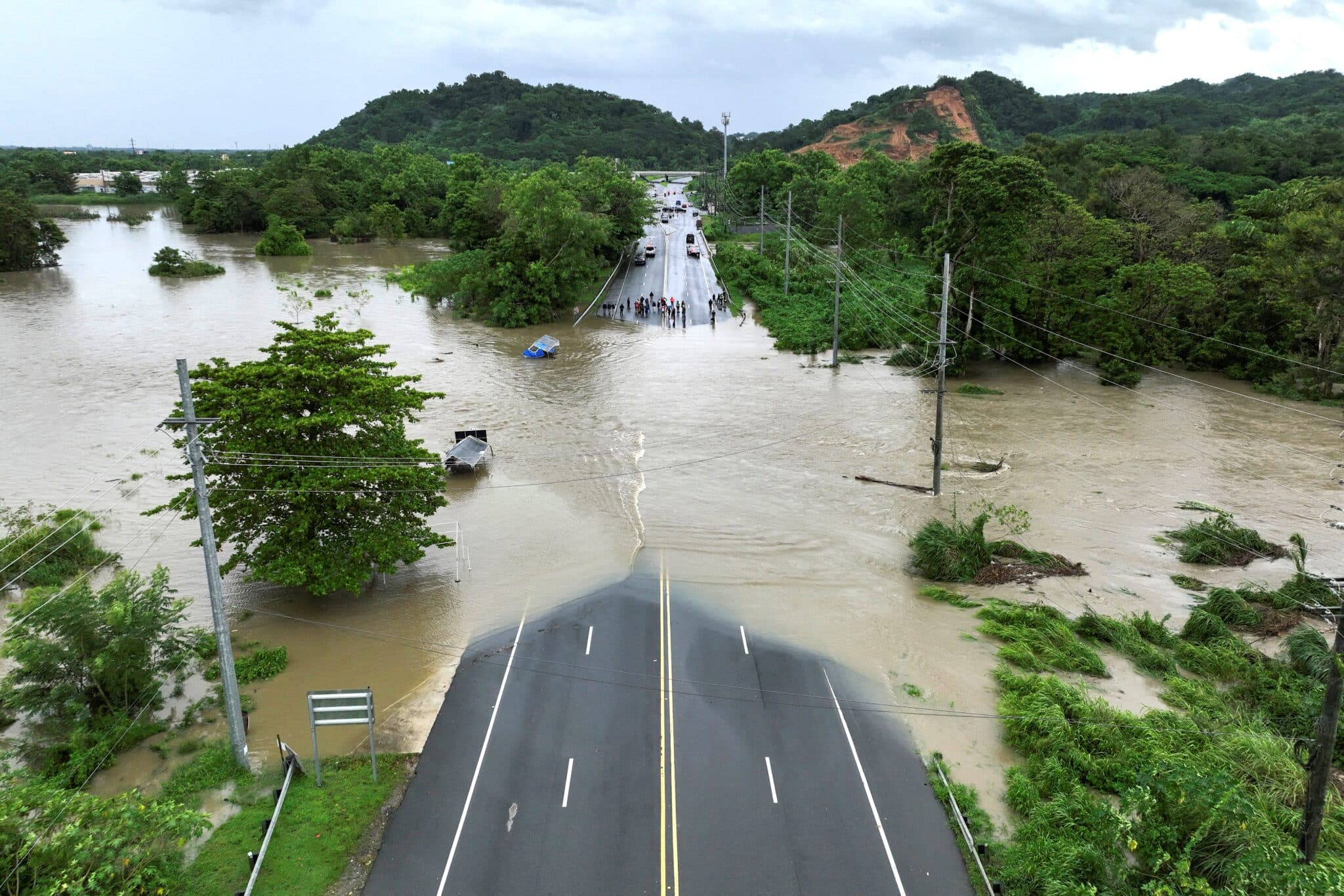 A drone view shows a bridge submerged by the flooded La Plata River in Toa Baja, Puerto Rico, in the aftermath of Hurricane Ernesto Aug.14, 2024. Archbishop Roberto O. Gonzalez Nieves of San Juan suspended Masses and pastoral activities Aug. 13 and 14 as Ernesto battered Puerto Rico, leaving hundreds of thousands without power. (OSV News photo/Ricardo Arduengo, Reuters)