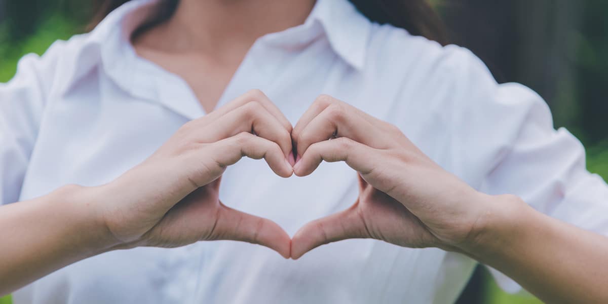 hand forming the symbol for heart