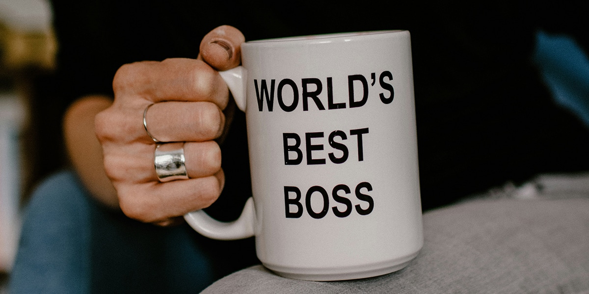 hand holding mug with imprint World's Best Boss