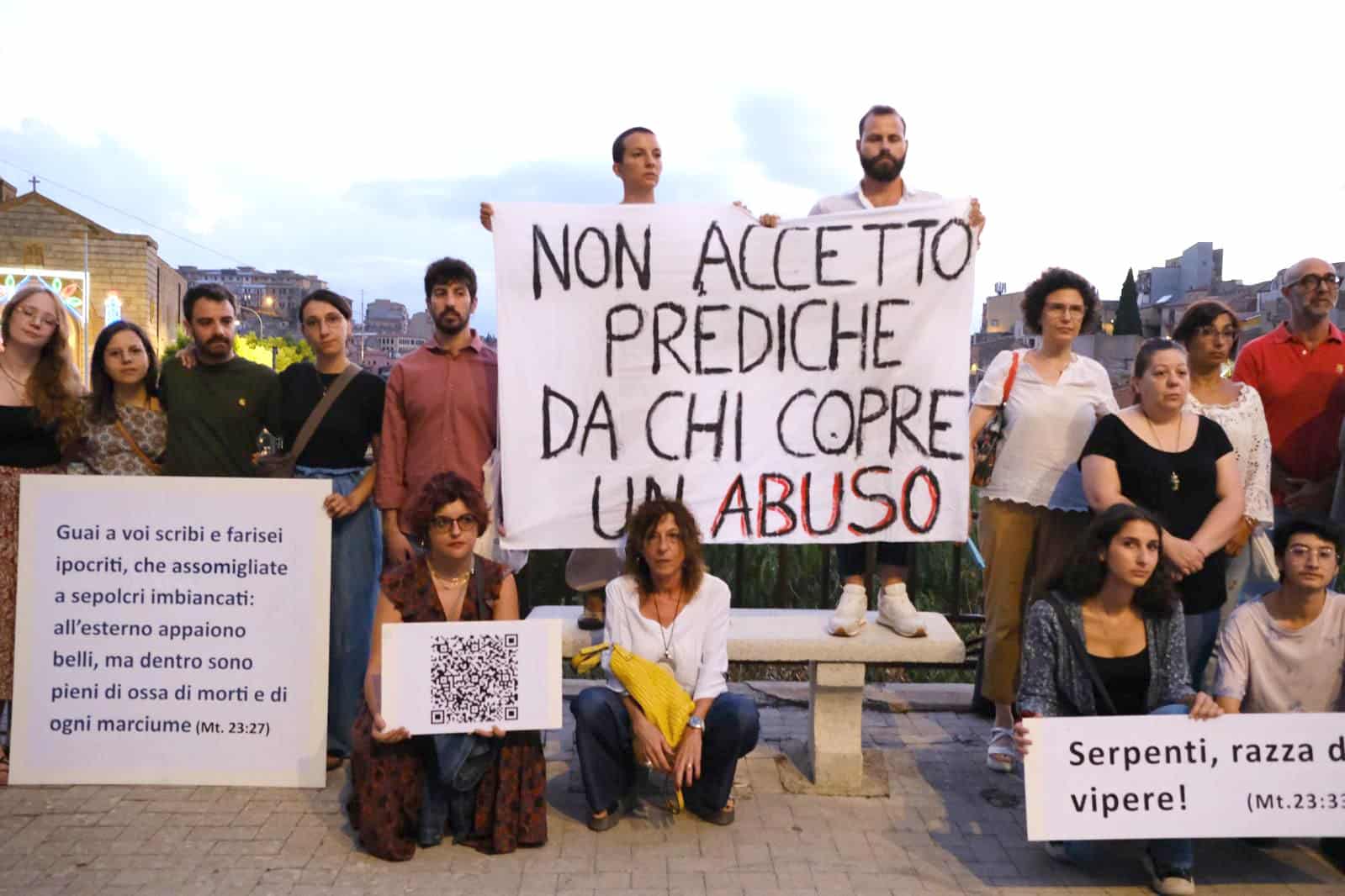 A group of protestors stand outside the Shrine of Our Lady of Valverde in the southern Italian city of Enna Aug. 22, 2024, to protest the local clergy’s role in covering up clerical sexual abuse. Among those present was Antonio Messina, center-right, who was 16 when Father Giuseppe Rugolo, a priest of the Diocese of Piazza Armerina, abused him. Father Rugolo was convicted March 5 on charges of aggravated sexual assault against Messina and another unnamed victim and sentenced to more than four years in prison. (OSV News photo/courtesy Antonio Messina)