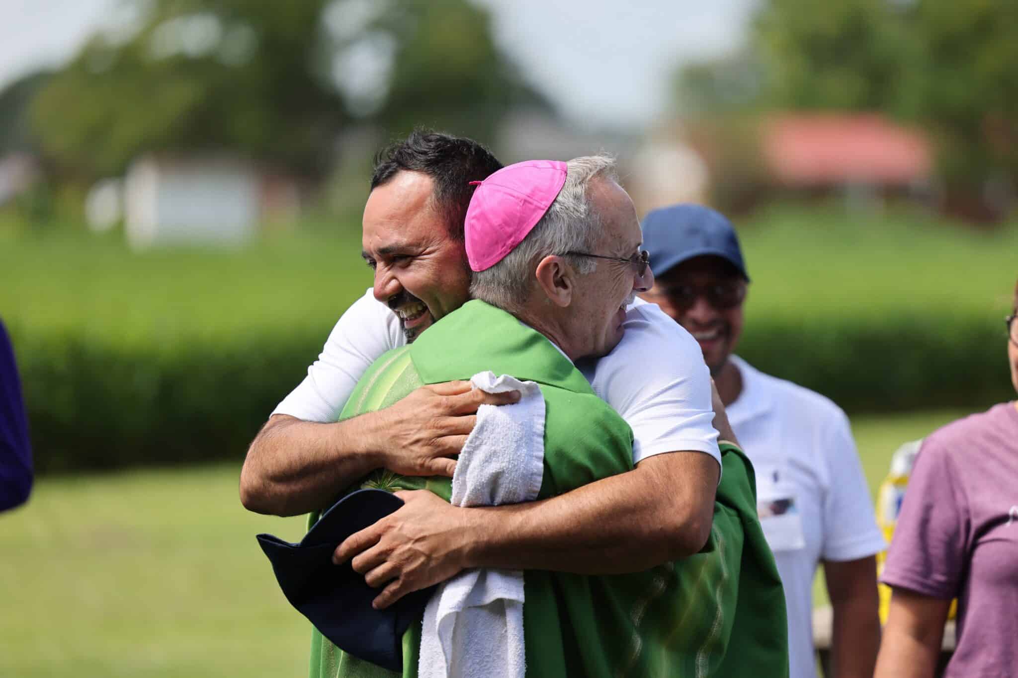 Bishop Luis R. Zarama of Raleigh, N.C., hugs an attendee of the XIII Encuentro Católico de Campesinos on Aug. 4, 2024, an annual event for farmworkers in the diocese, many of whom are temporal H-2A agricultural workers. About 300 workers and volunteers participated this year. (OSV News/courtesy of USCCB Public Affairs)