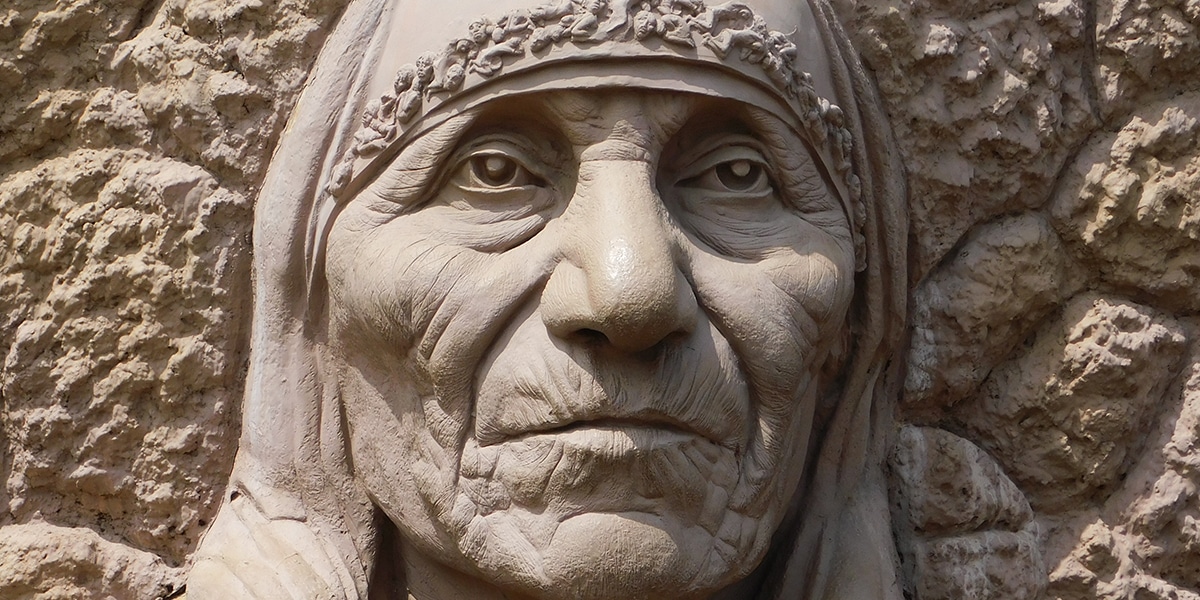 a stone sculpture of Mother Teresa