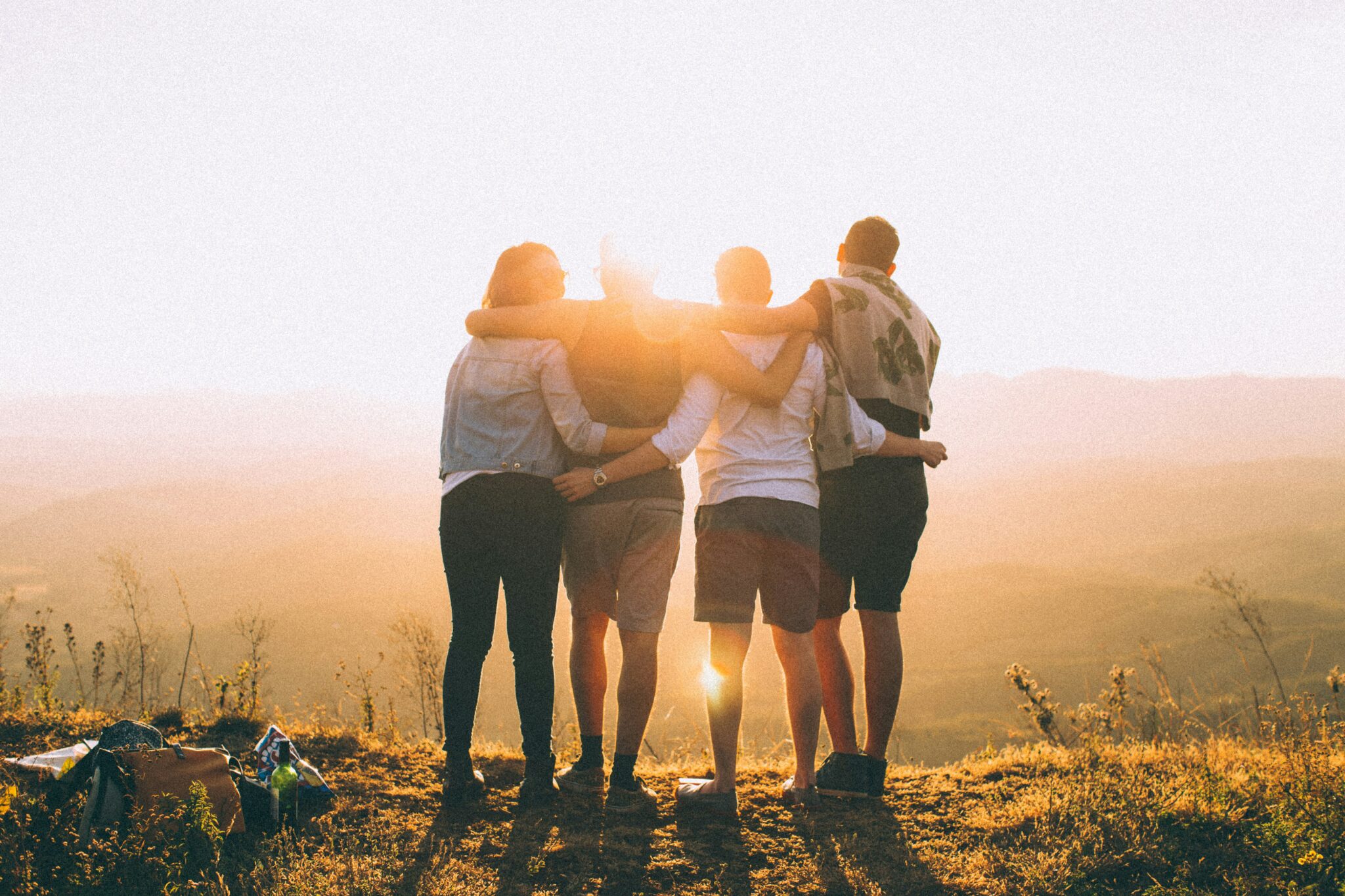 People watching the sunset | Photo by Helena Lopes on Unsplash