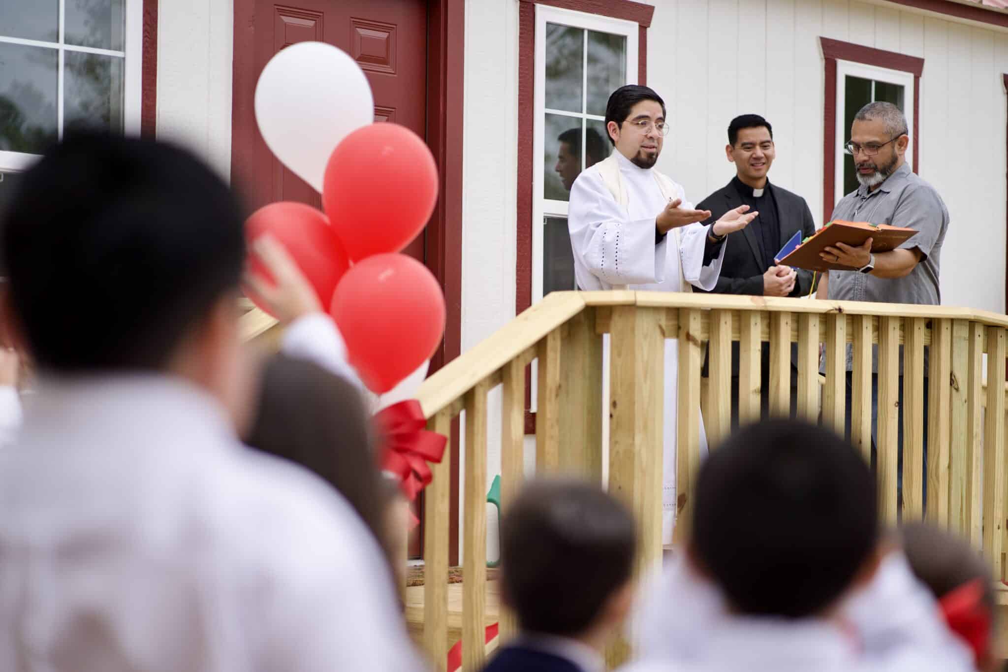 Father Matthew De Leon, pastor of Sacred Heart Church in Uvalde, Texas, prays during the Sept. 6, 2024, opening and dedication ceremony of a new counseling center to provide ongoing community healing and support following the 2022 mass shooting at Robb Elementary School.