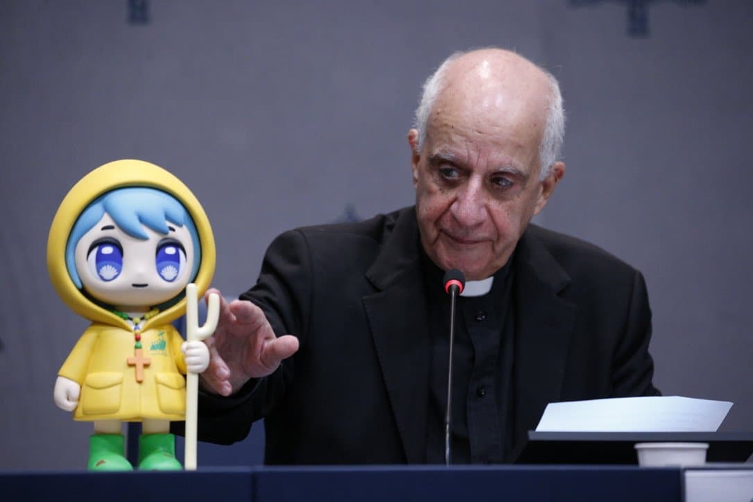 Archbishop Rino Fisichella, pro-prefect of the Dicastery for Evangelization's section for new evangelization and the chief organizer of the Holy Year 2025, presents the official mascot of the Jubilee Year during a news conference at the Vatican Oct. 28, 2024.