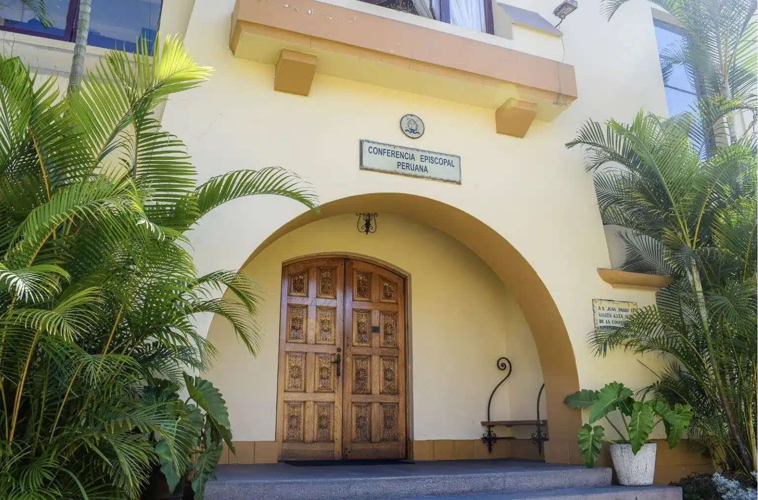 a building with a door and a sign