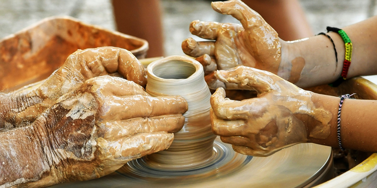 potter hands forming clay