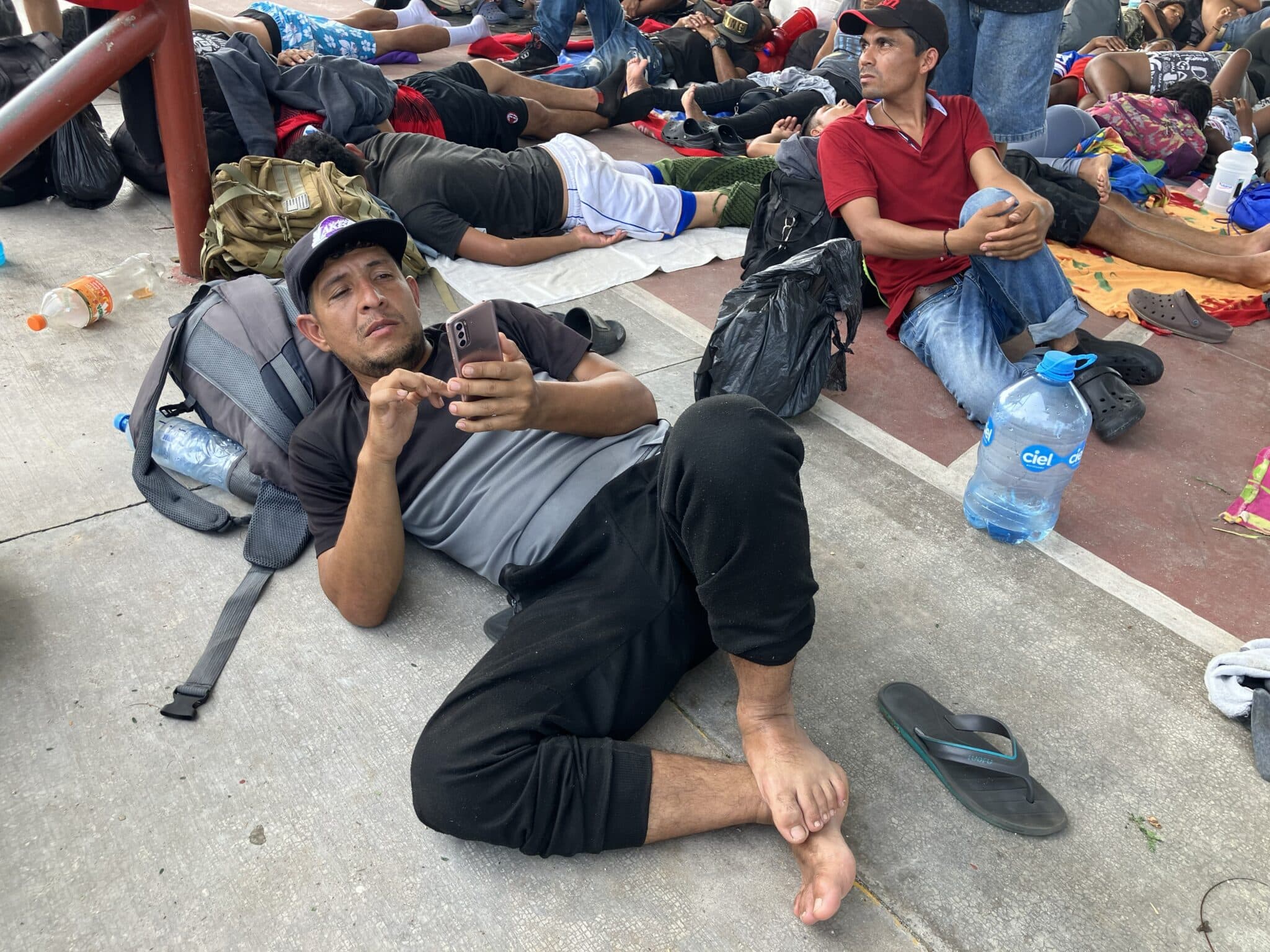 A migrant identifying himself as Luis tries to book an appointment for entering the U.S. using the CBP One smartphone app, while resting in Mapastepec, Mexico. Frustrated with the lack of appointments available via the app, Luis and hundreds of other migrants in Mexico's southern Chiapas state formed a caravan to the U.S. in early October. (OSV News photo/David Agren)