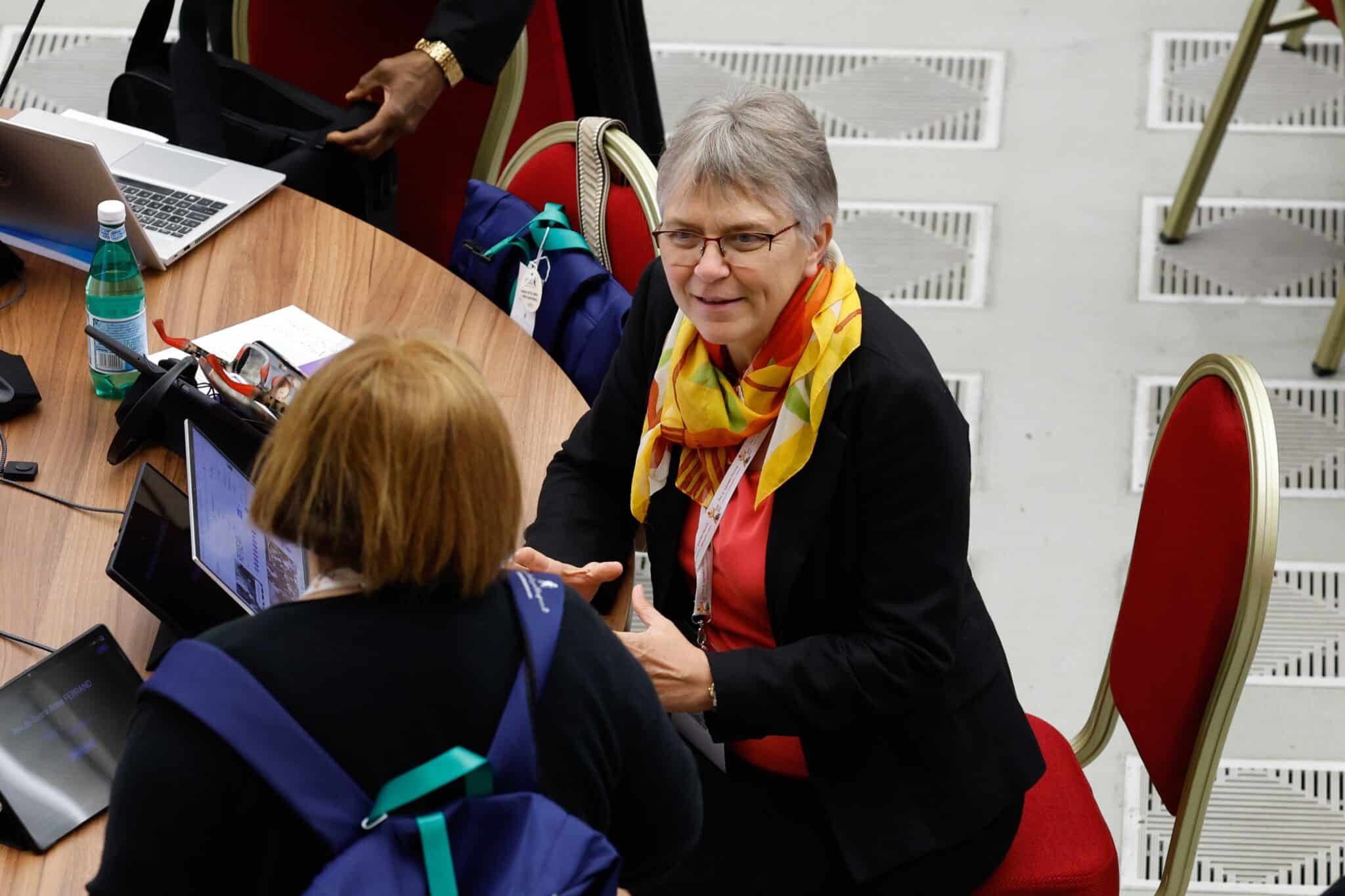 Synod participants visit before the start of the first working session of the Synod of Bishops in the Vatican's Paul VI Audience Hall