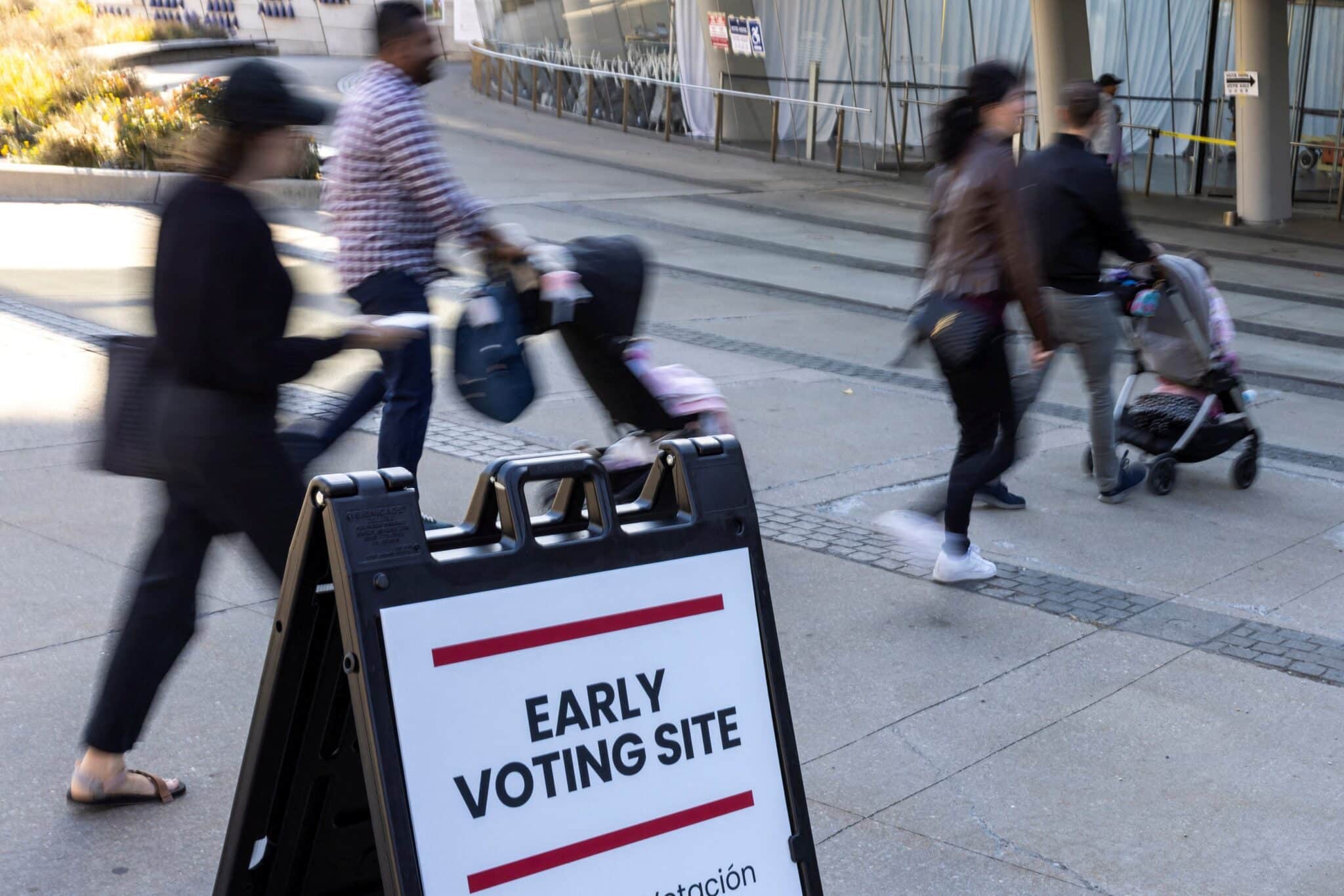 Voters arrive at a polling station during early voting at the Brooklyn Museum in Brooklyn, N.Y., Oct. 26, 2024.