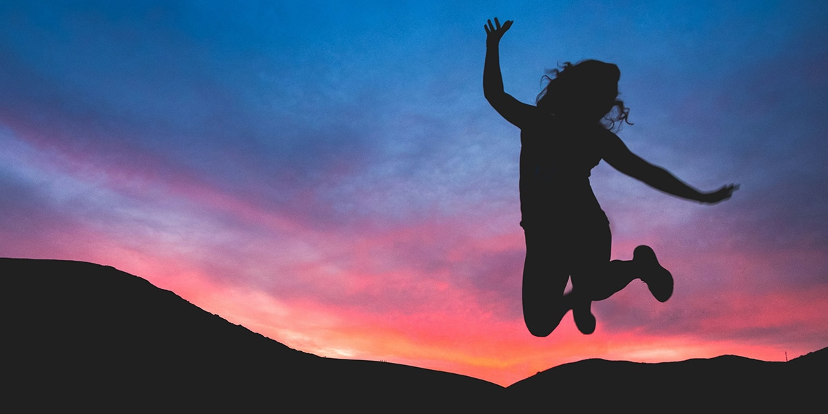 woman jumping full of joy