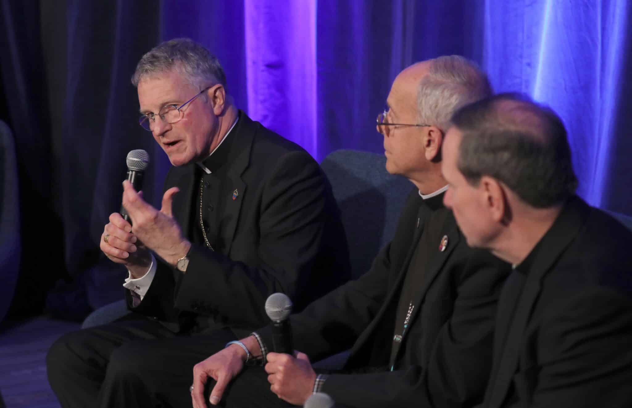 Archbishop Timothy P. Broglio of the U.S. Archdiocese for the Military Services, president of the U.S. Conference of Catholic Bishops, speaks during a news conference at a Nov. 12, 2024, session of the fall general assembly of the USCCB in Baltimore. Also pictured are Bishops Mark J. Seitz of El Paso, Texas, and Michael F. Burbidge of Arlington, Va.