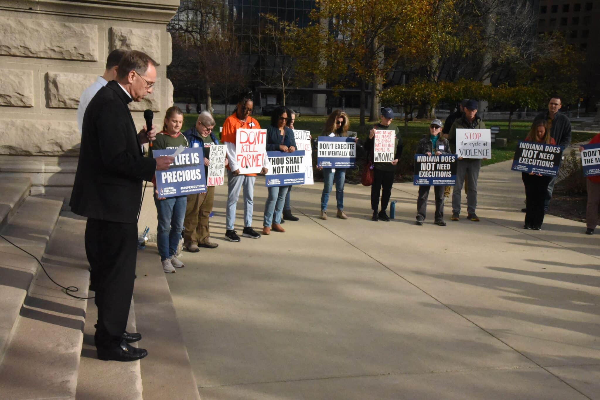 Indianapolis Archbishop Charles C. Thompson offers an opening prayer at a rally Nov. 17, 2024, on the grounds of the Indiana Statehouse in Indianapolis to call on Indiana Gov. Eric Holcomb to halt the execution of Joseph Corcoran scheduled for Dec. 18. It would be the first execution in the state in more than a decade. The rally was sponsored by the Indiana Abolition Coalition. Activists pushing President Joe Biden to commute existing federal death sentences during his final months in office hope that if he does that, his action could be "the beginning of the end" of the death penalty at the federal and state levels. (OSV News photo/Sean Gallagher, The Criterion)