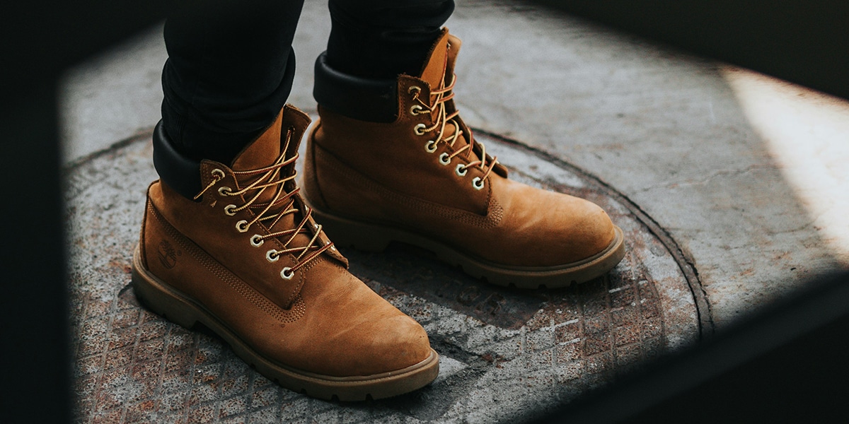 person wearing boots standing in the center of a circle