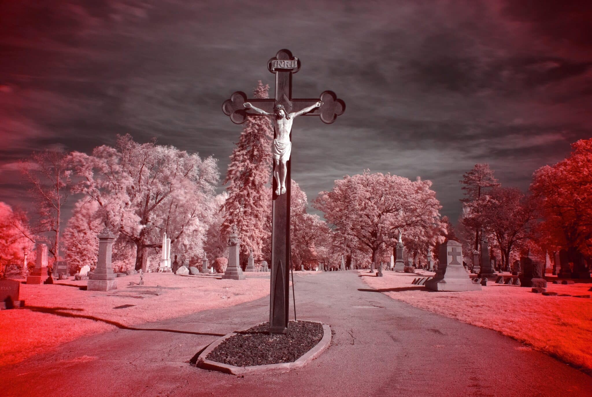 A crucifixion scene stands at one entrance of Allouez Catholic Cemetery in Allouez, Wis. All Saints' Day, a holy day of obligation in the Catholic Church, is celebrated on Nov. 1. The photograph was taken Oct. 18, 2023, using an infrared camera filter. (OSV News photo/Sam Lucero)