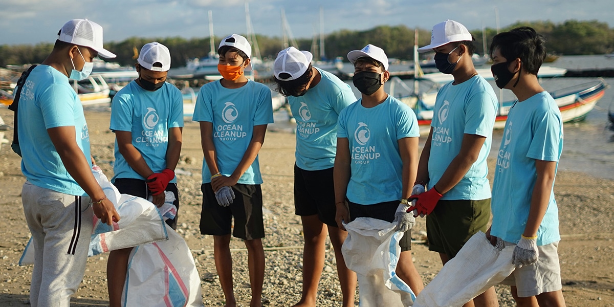 Group of volunteers cleaning up a beach