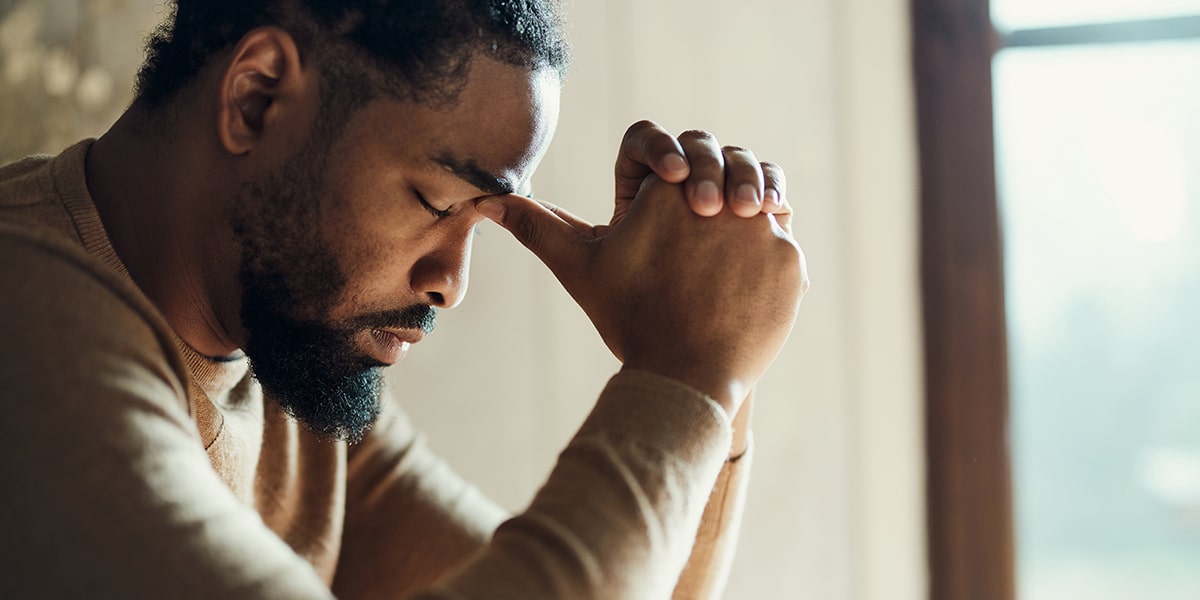 man praying in silence