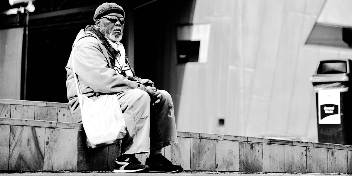 Older man sitting quietly in solitude