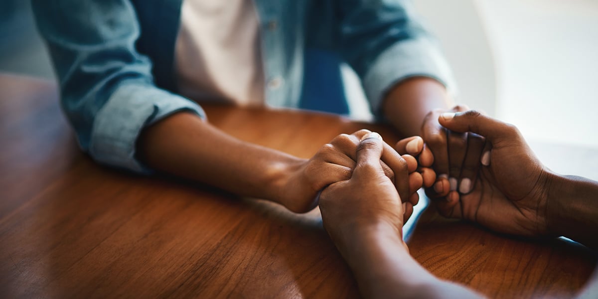 people holding their hands in act of mercy and forgiveness