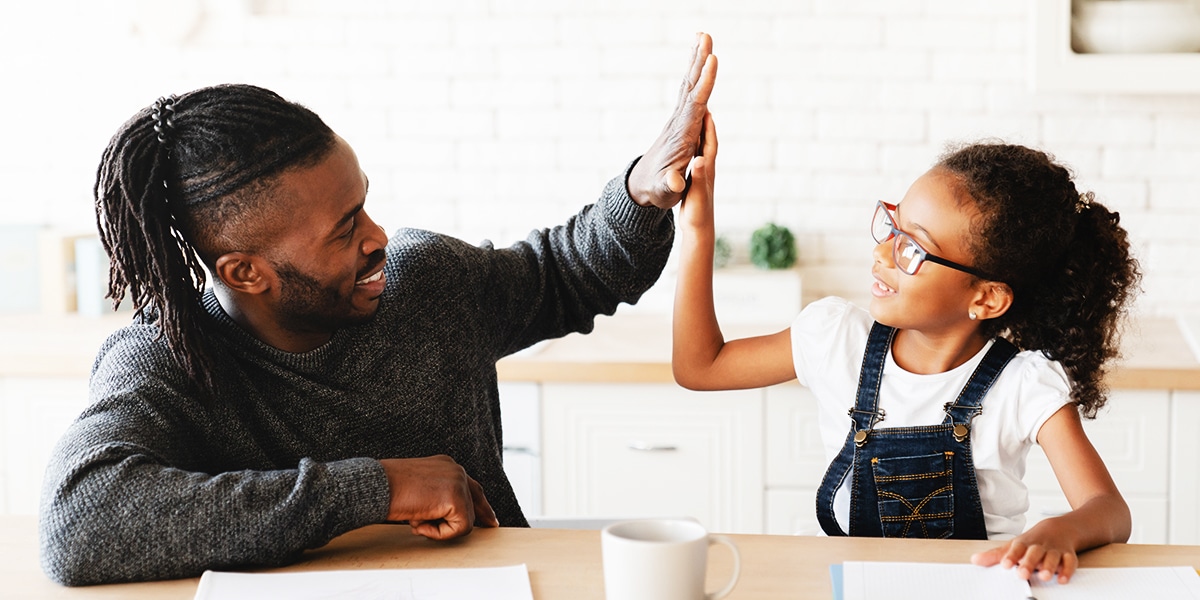 parent affirming a child with a high-five