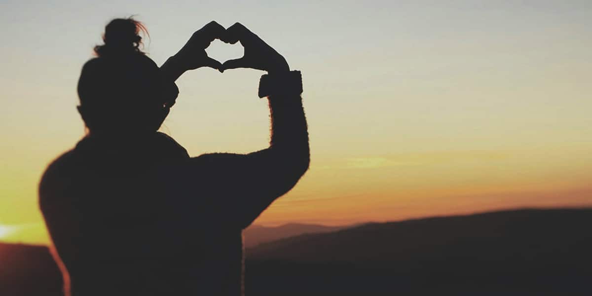 woman's hands forming a heart