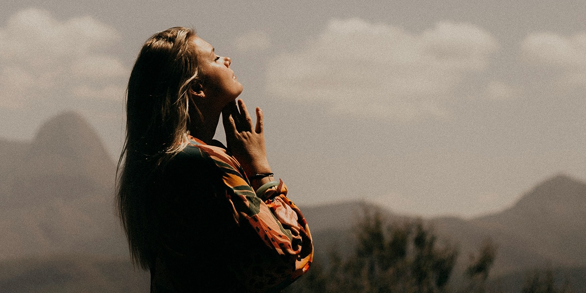 woman meditating in quiet surrounding