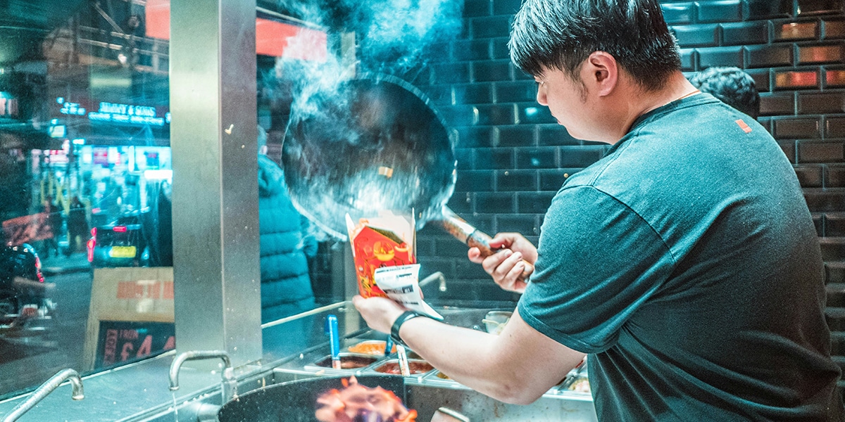 A cook is preparing food.