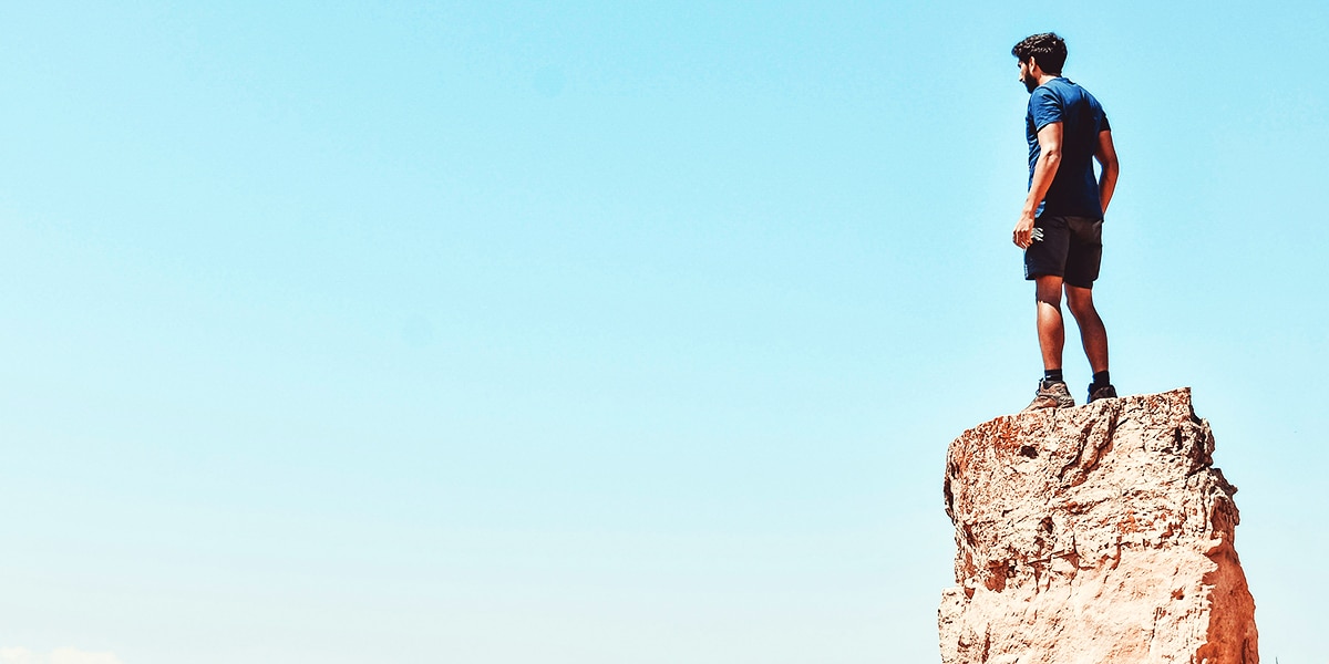 man standing on a rock