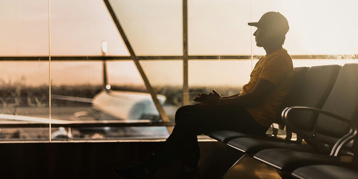 man waiting to board a plane at airport