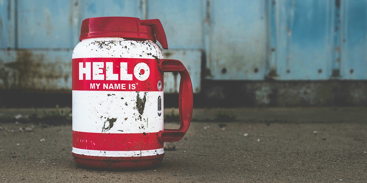 mug with "hello my name is" sticker