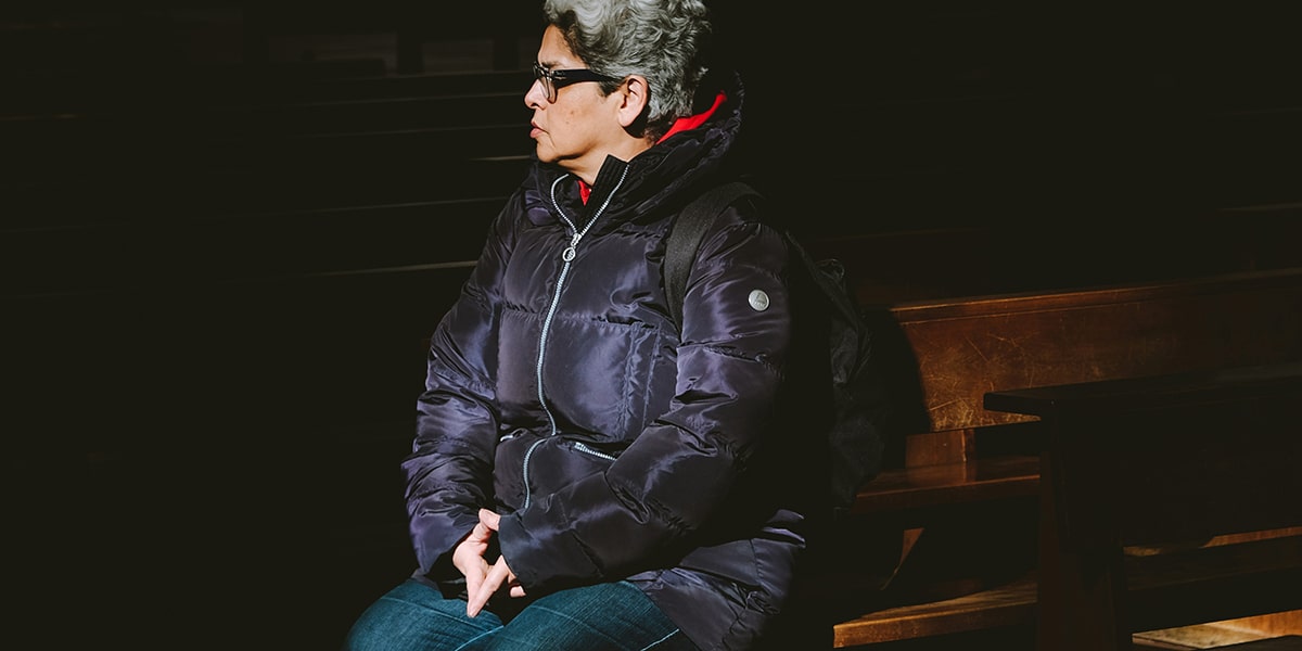 woman praying in a church