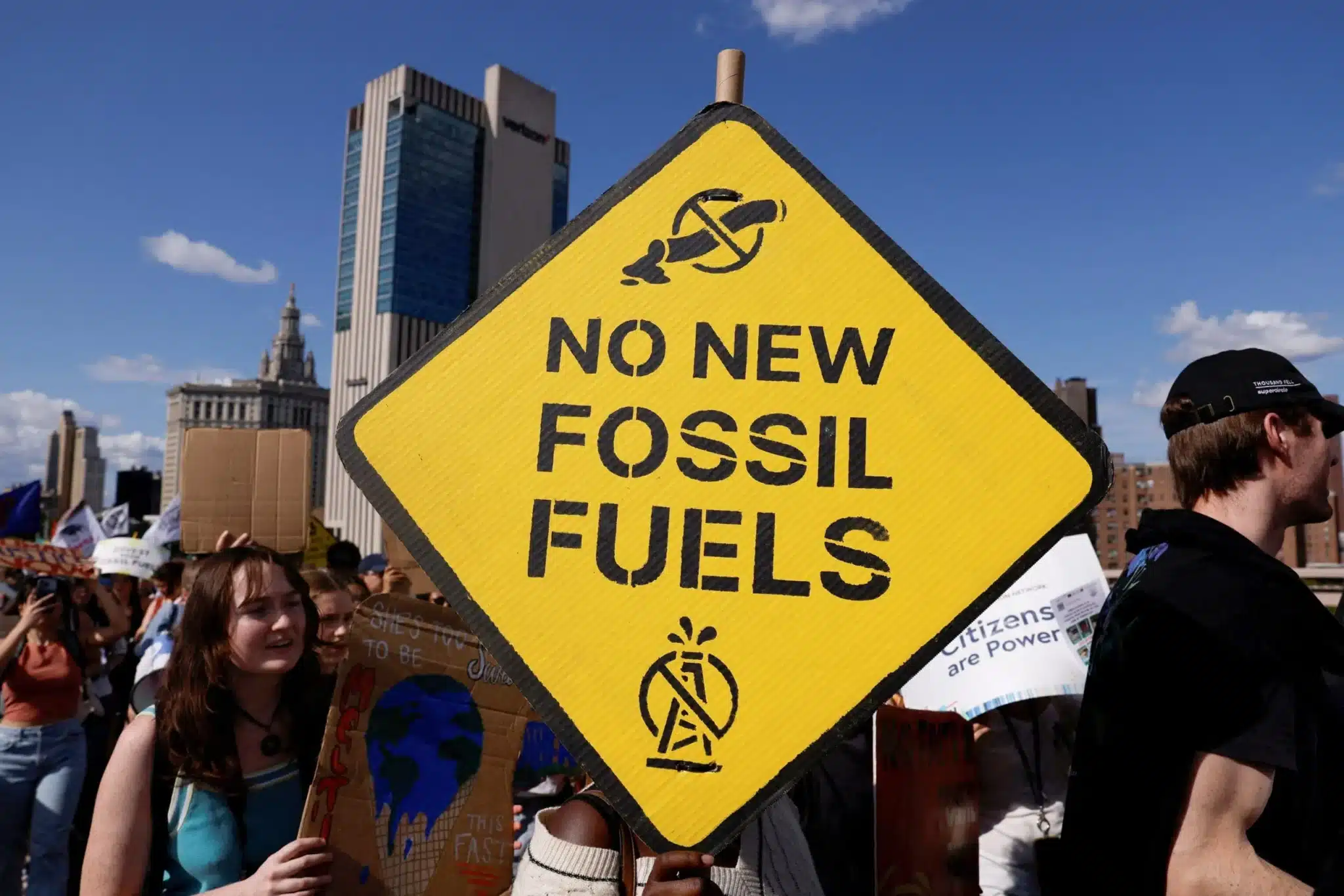 Demonstrators march across the Brooklyn Bridge in New York City Sept. 20, 2024, to call for an end to the era of fossil fuels (OSV News photo/Shannon Stapleton, Reuters)