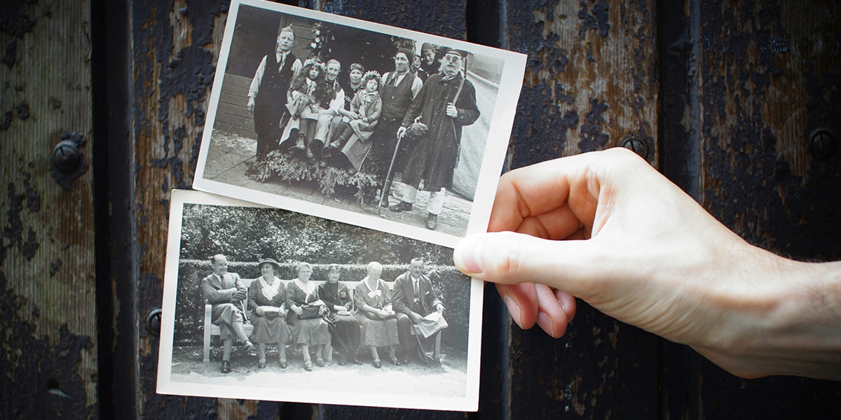 hands holding old pictures of relatives