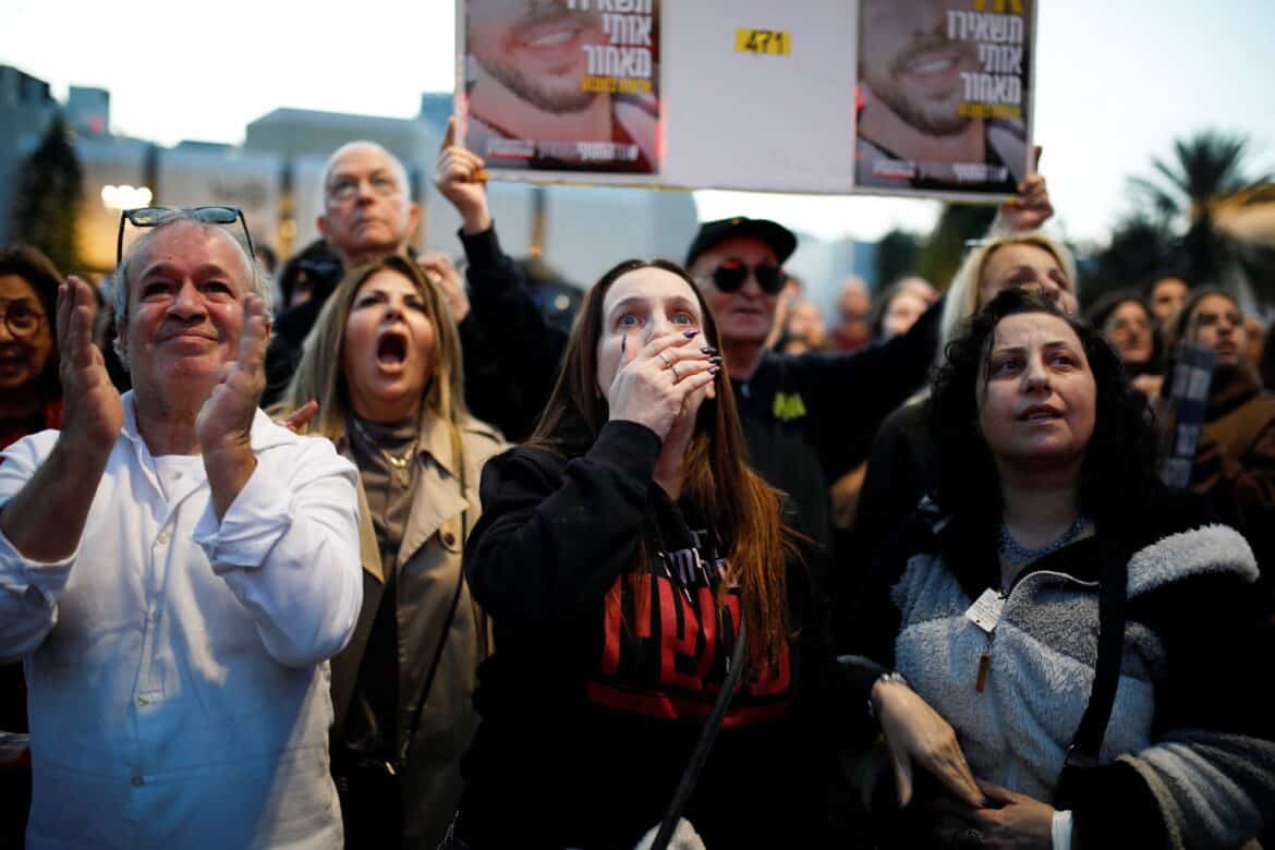 People react in Tel Aviv, Israel, Jan 19, 2025, as they watch news coverage of the release of Romi Gonen, Doron Steinbrecher and Emily Damari, three female hostages who have been held in Gaza since the deadly Oct. 7, 2023, attack, as part of a ceasefire deal between Hamas and Israel. (OSV News photo/Shir Torem, Reuters) Editors: EDITORIAL USE ONLY. NO USE IN ISRAEL. NO COMMERCIAL OR EDITORIAL SALES IN ISRAEL